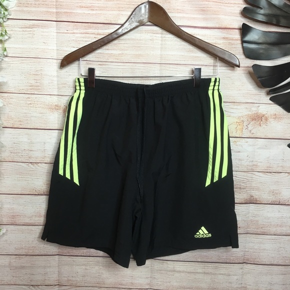 adidas black shorts with yellow stripes